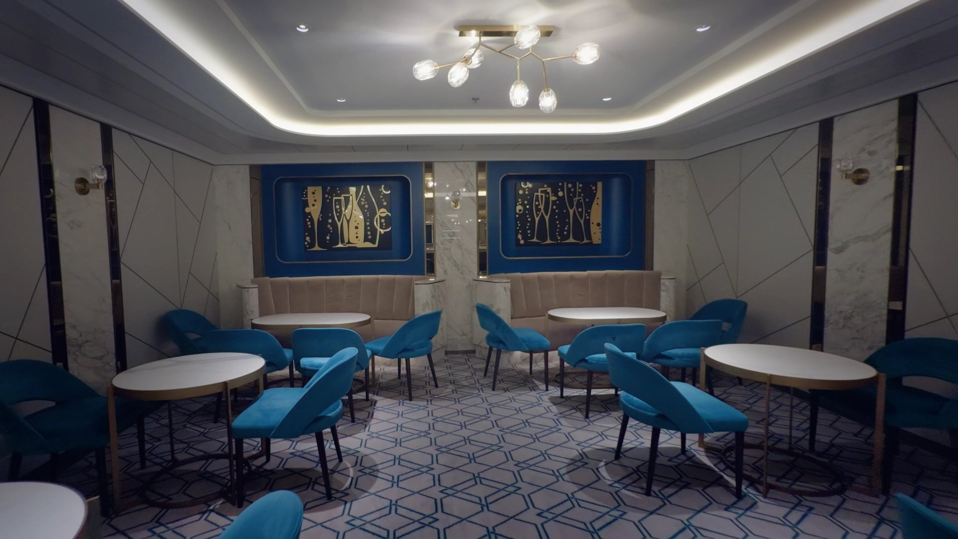 Color Graded Apple Log 2 Footage of a Modern interior with blue chairs and round tables in a stylish room.
