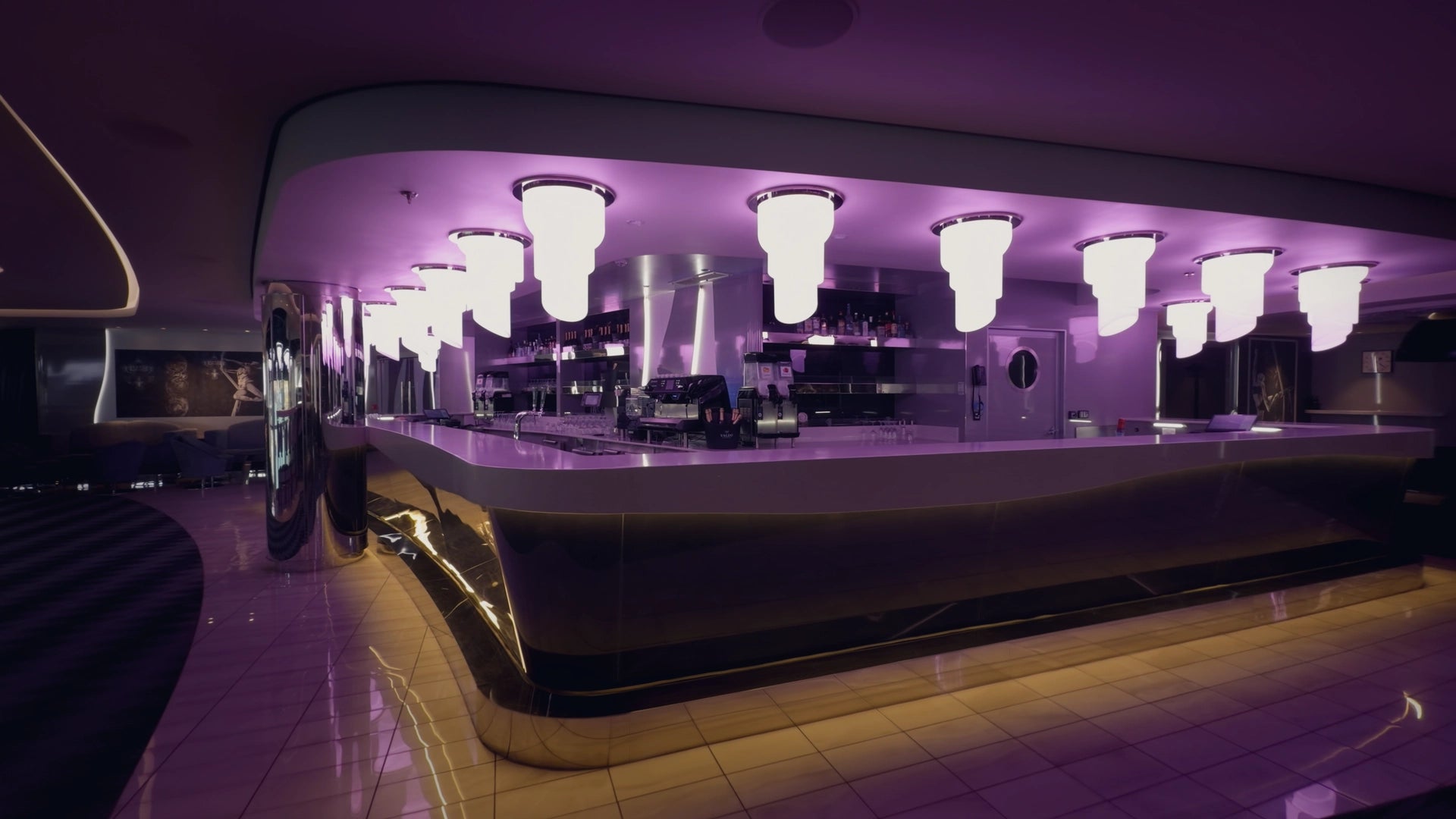 Color Graded Apple Log 2 Footage of a Modern bar interior with purple lighting and reflective floor
